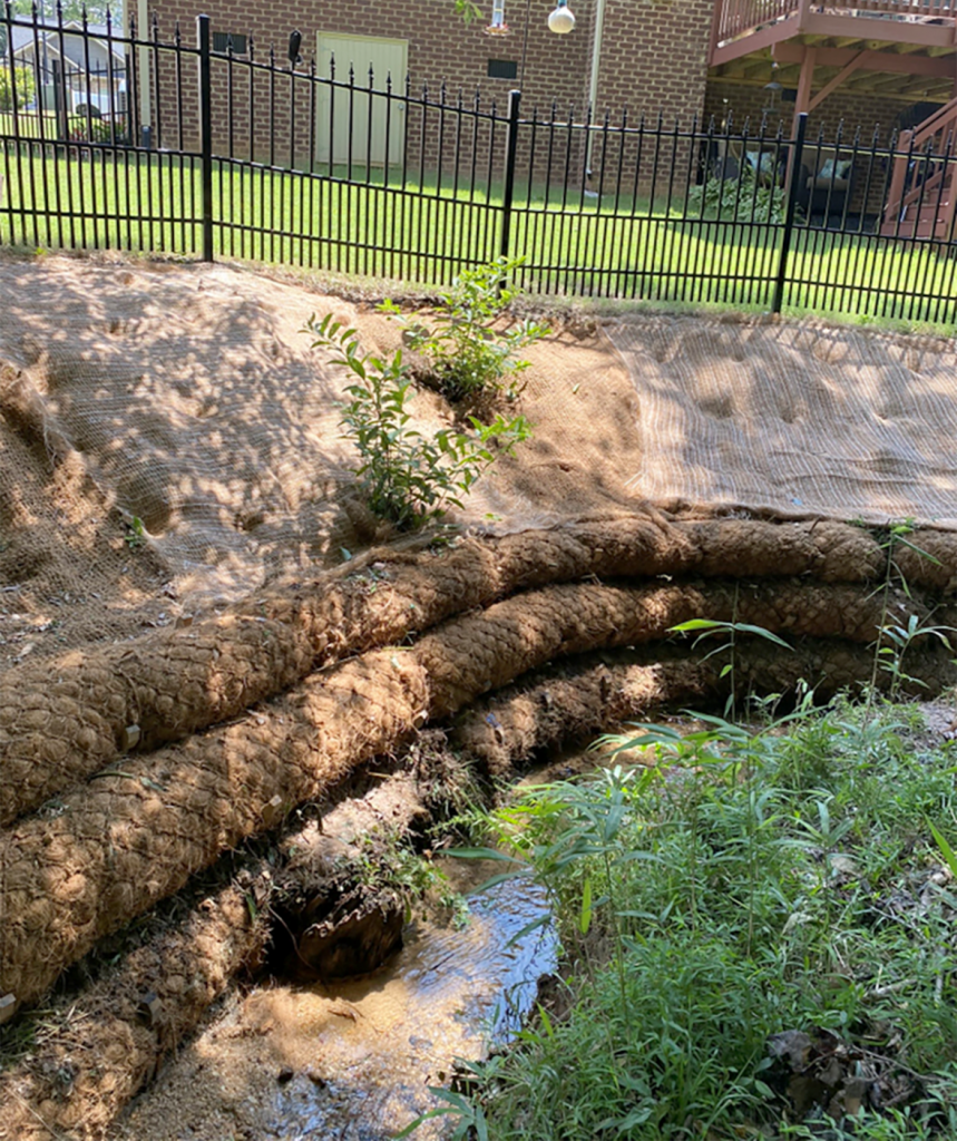 Coir logs placed along a stream 