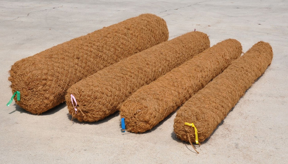 Contractors installing coir logs